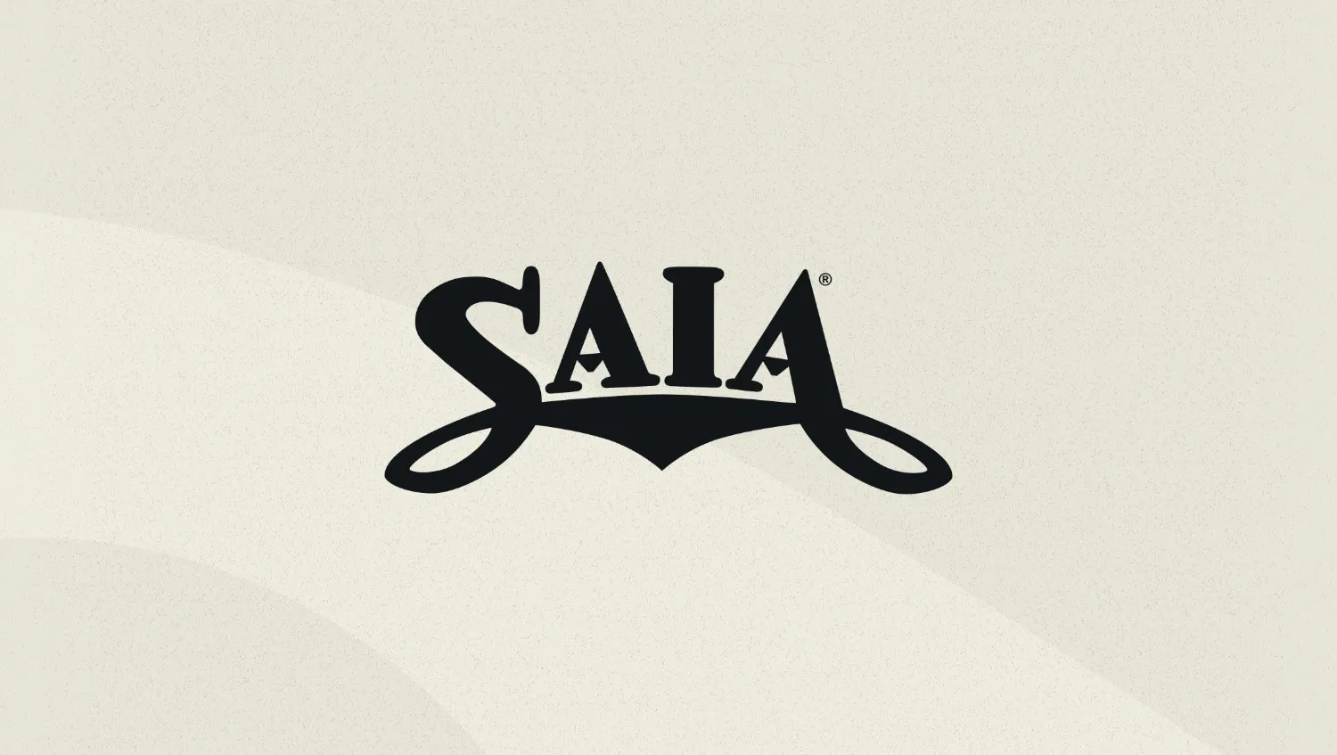 The SAIA logo displayed prominently in bold black letters on a light beige textured background