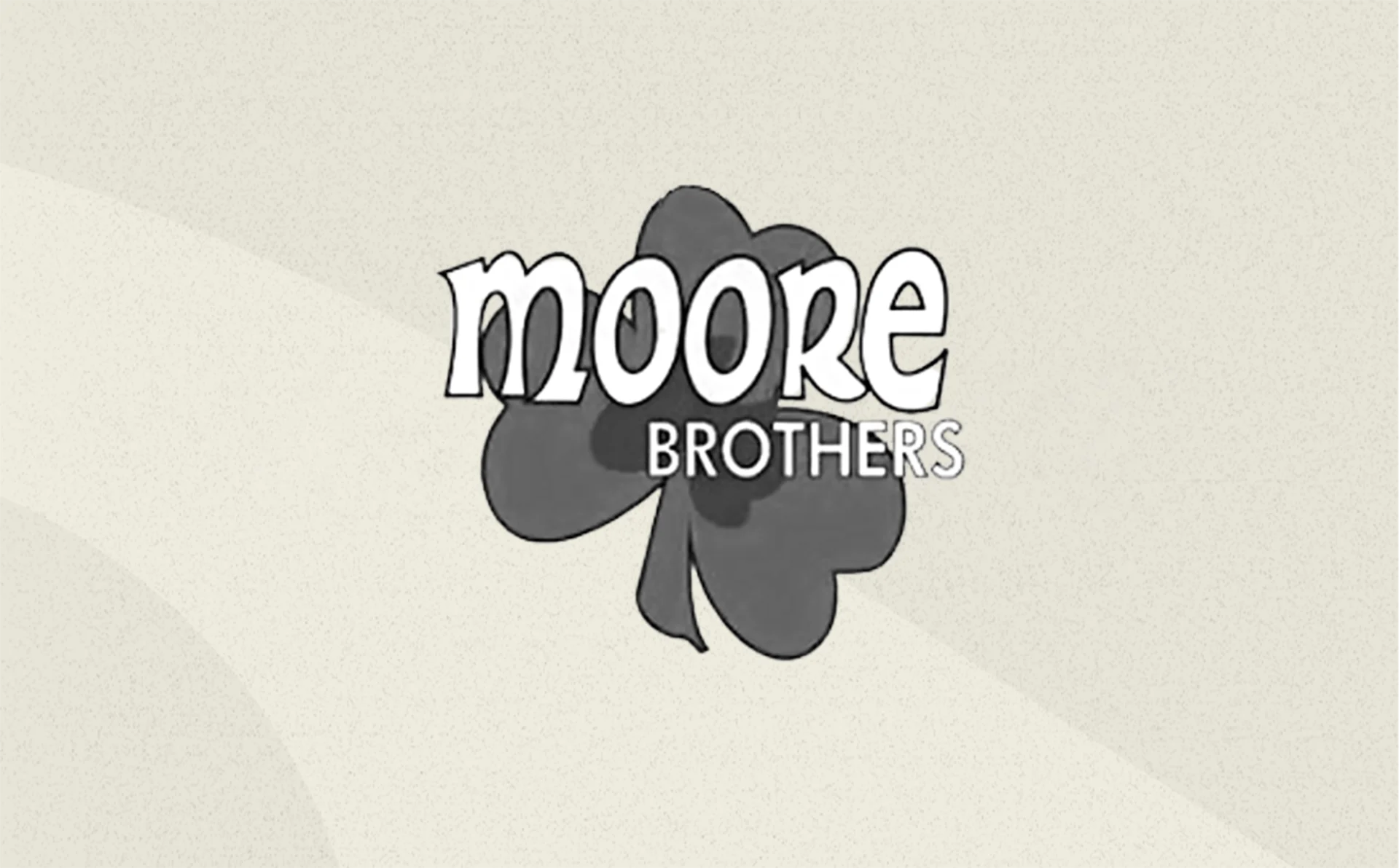 Moore Brothers logo featuring a clover, illustrating the company's brand image